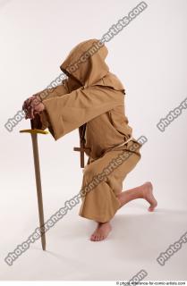 02 2018 01 JOEL ADAMSON MONK KNEELING POSE WITH SWORD